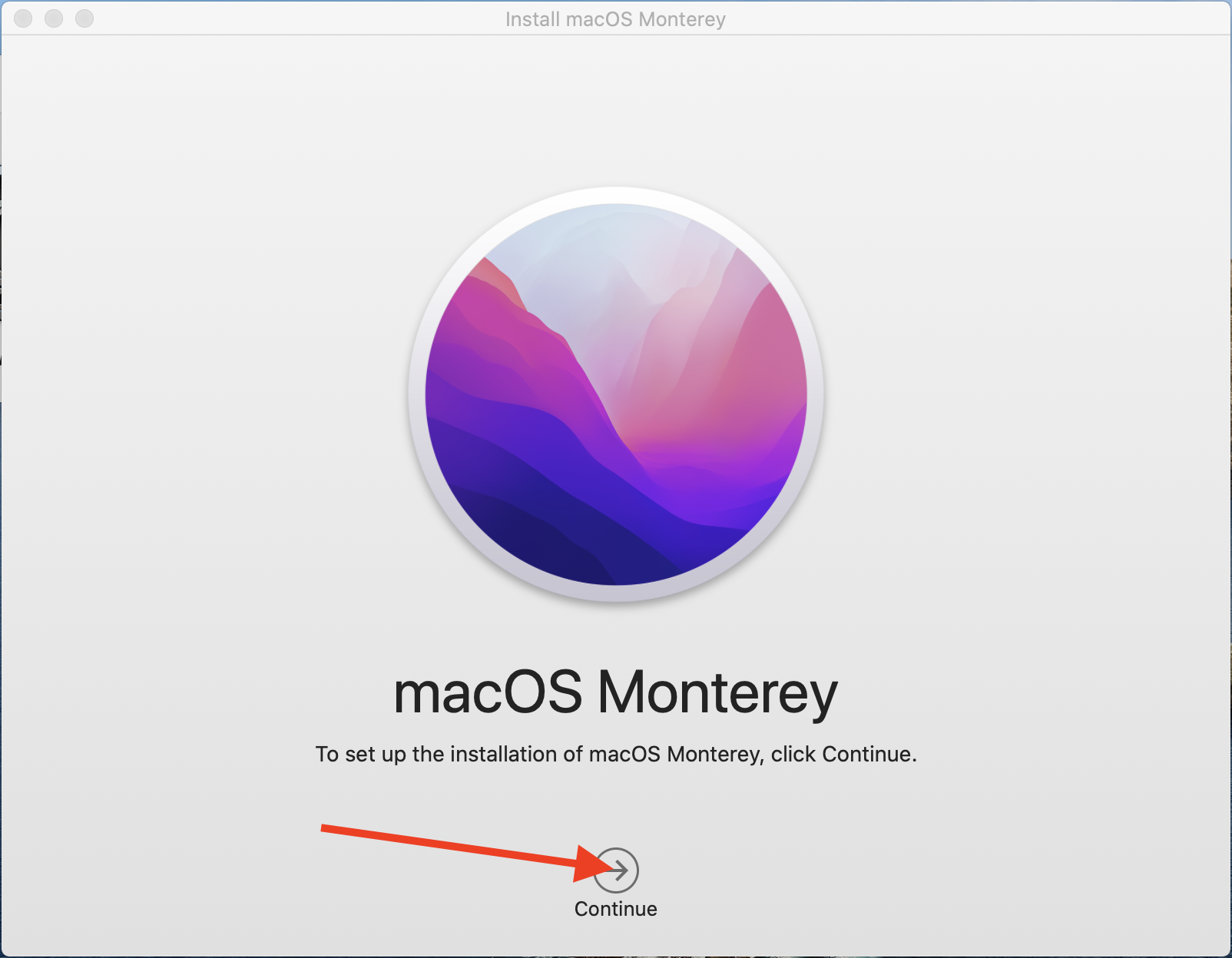 macOS Monterey upgrade window arrow highlighting continue.